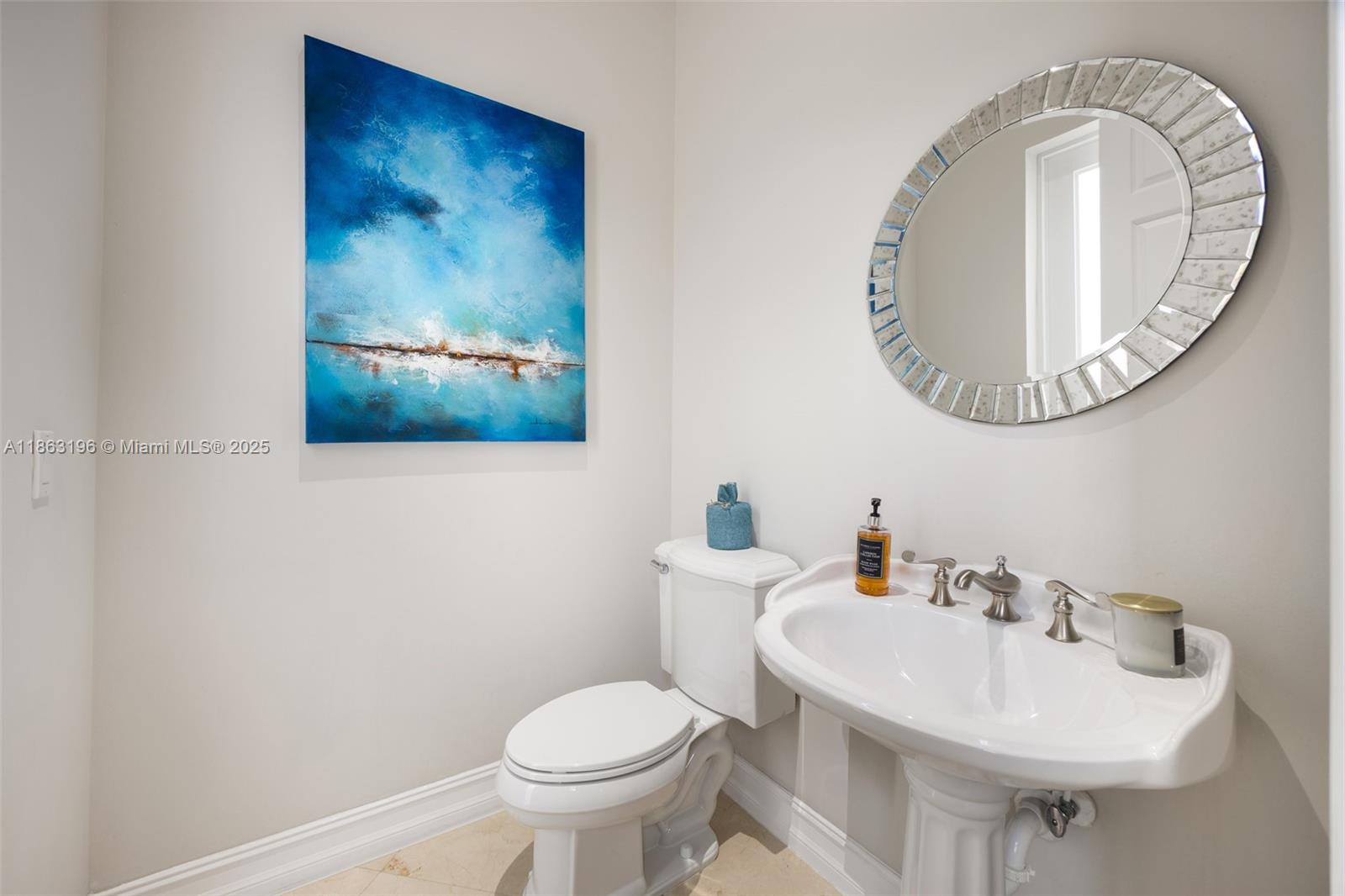 9445 Southwest 68th Street Miami, FL 33173 - Photo 32 of 41 a bathroom with a toilet a sink and a mirror