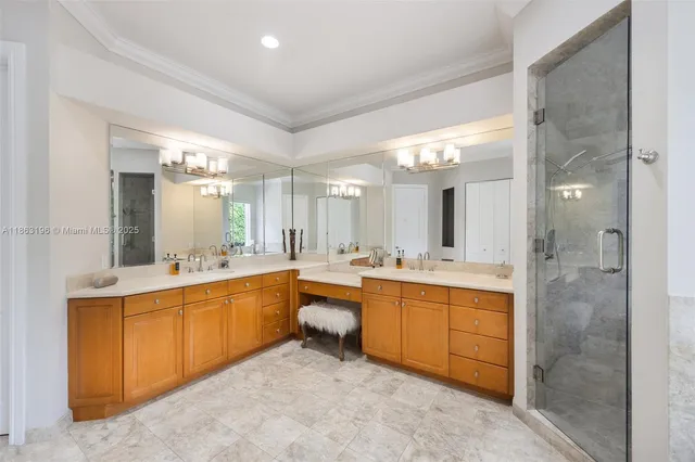 a large bathroom with a large tub shower and sink