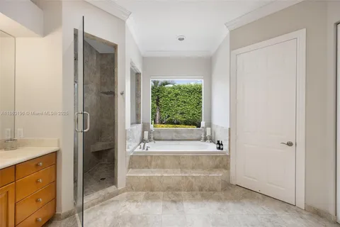 a bathroom with a bathtub and a sink