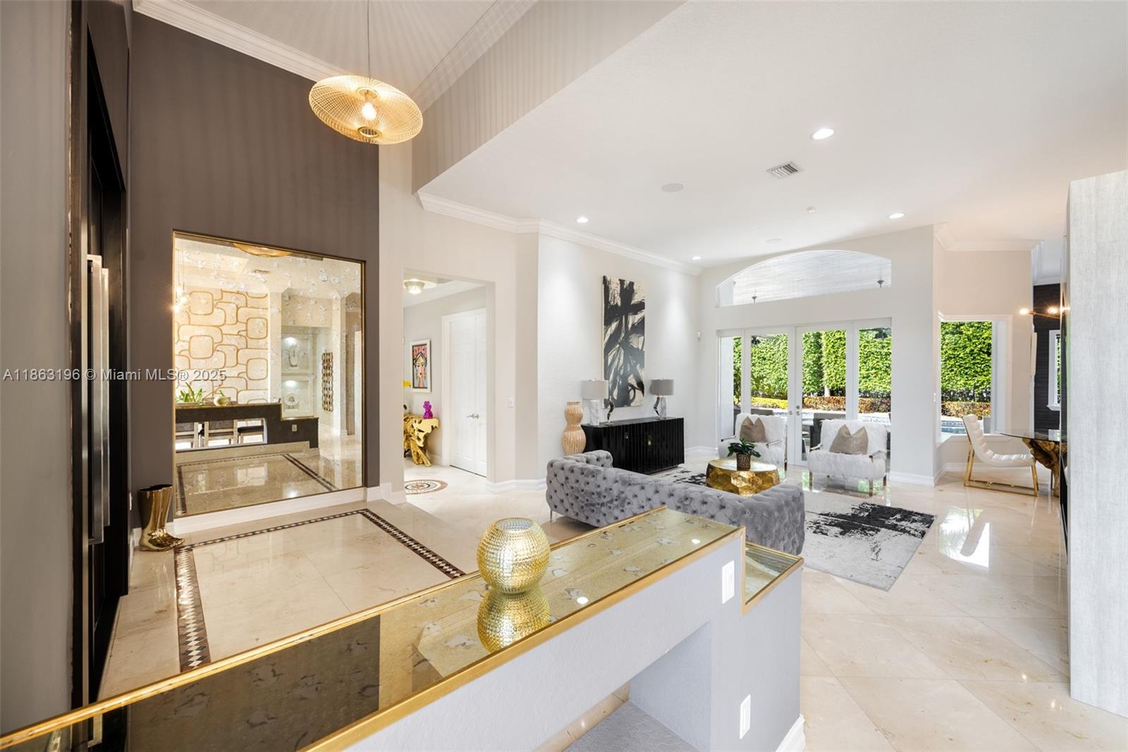 9445 Southwest 68th Street Miami, FL 33173 - Photo 7 of 41 a living room with large window furniture and a large window