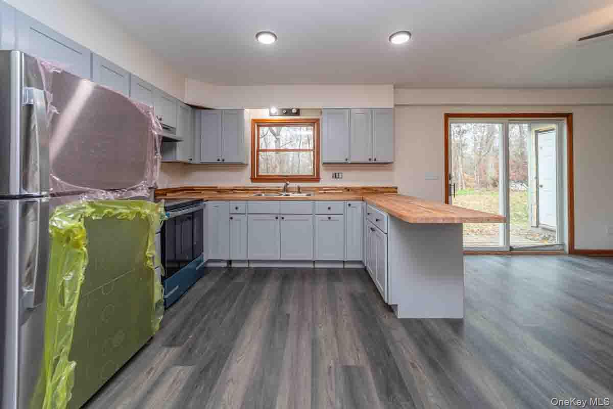 132 Red Top Road Wallkill, NY 12589 - Photo 5 of 19 a kitchen with sink cabinets and wooden floor