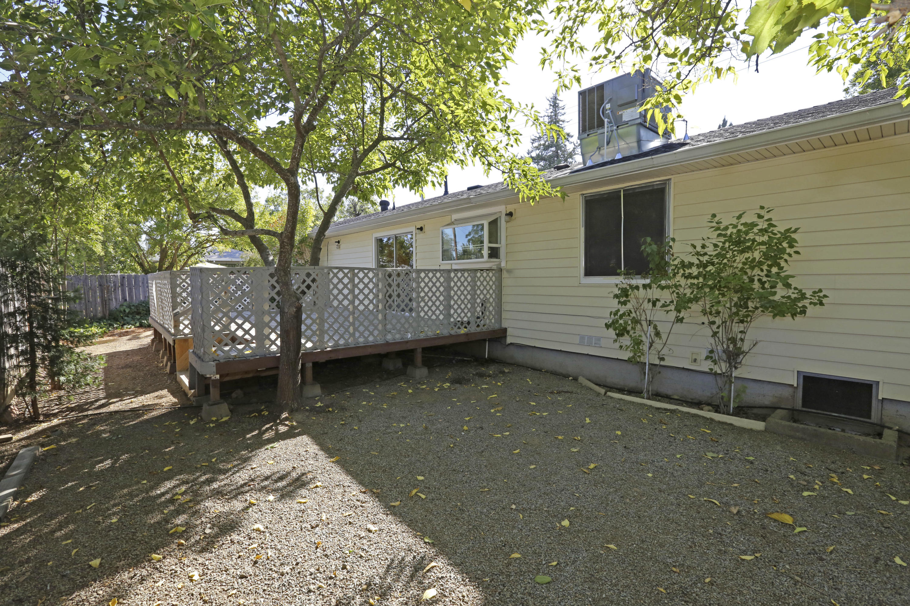 4521 Cedars Road Redding, CA 96001 - Photo 12 of 13 a view of a house with a yard