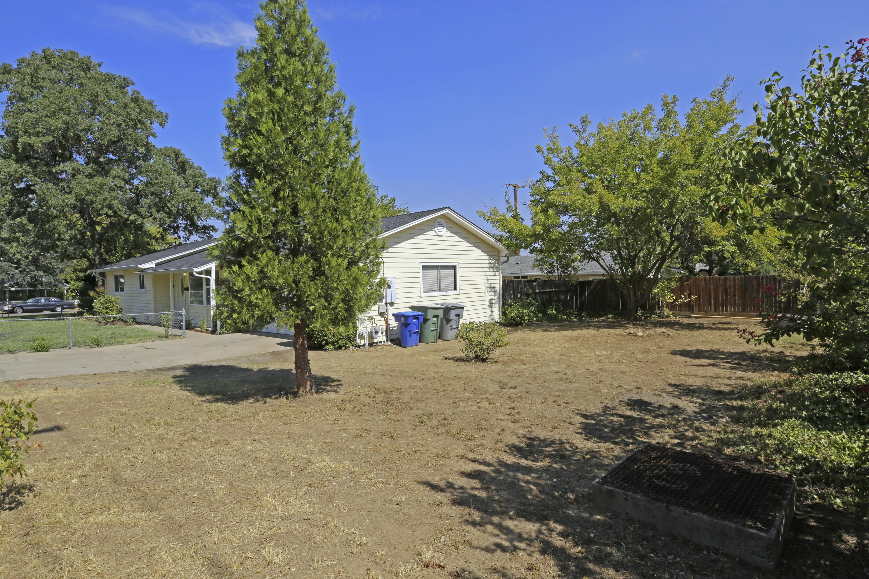 4521 Cedars Road Redding, CA 96001 - Photo 13 of 13 a house with trees in the background