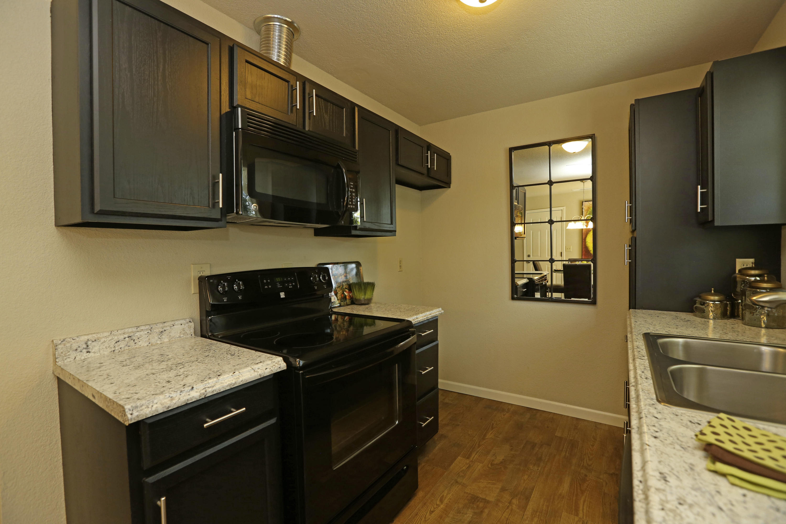 4521 Cedars Road Redding, CA 96001 - Photo 4 of 13 a kitchen with a sink and a stove top oven