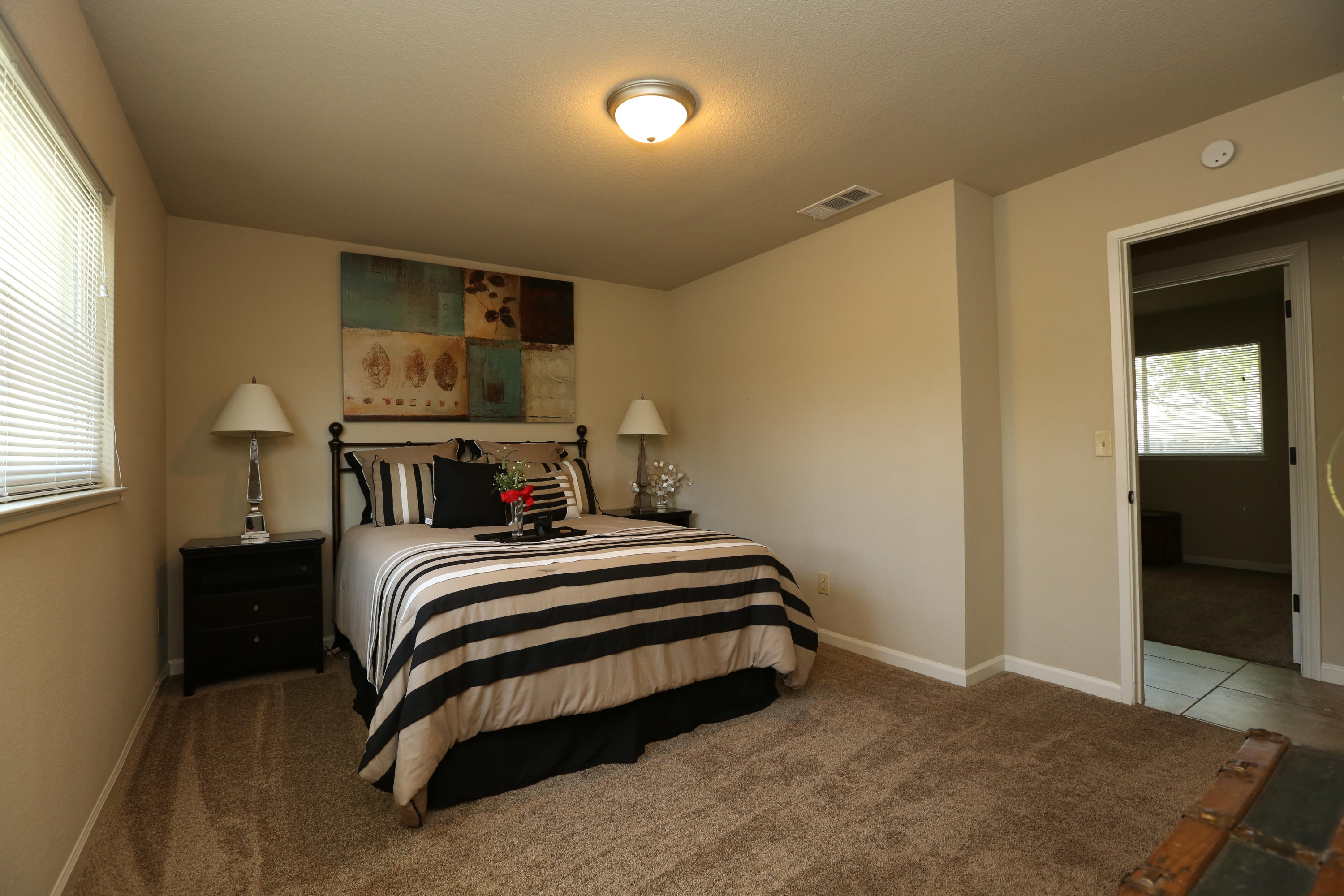 4521 Cedars Road Redding, CA 96001 - Photo 10 of 13 a bedroom with double bed and a window