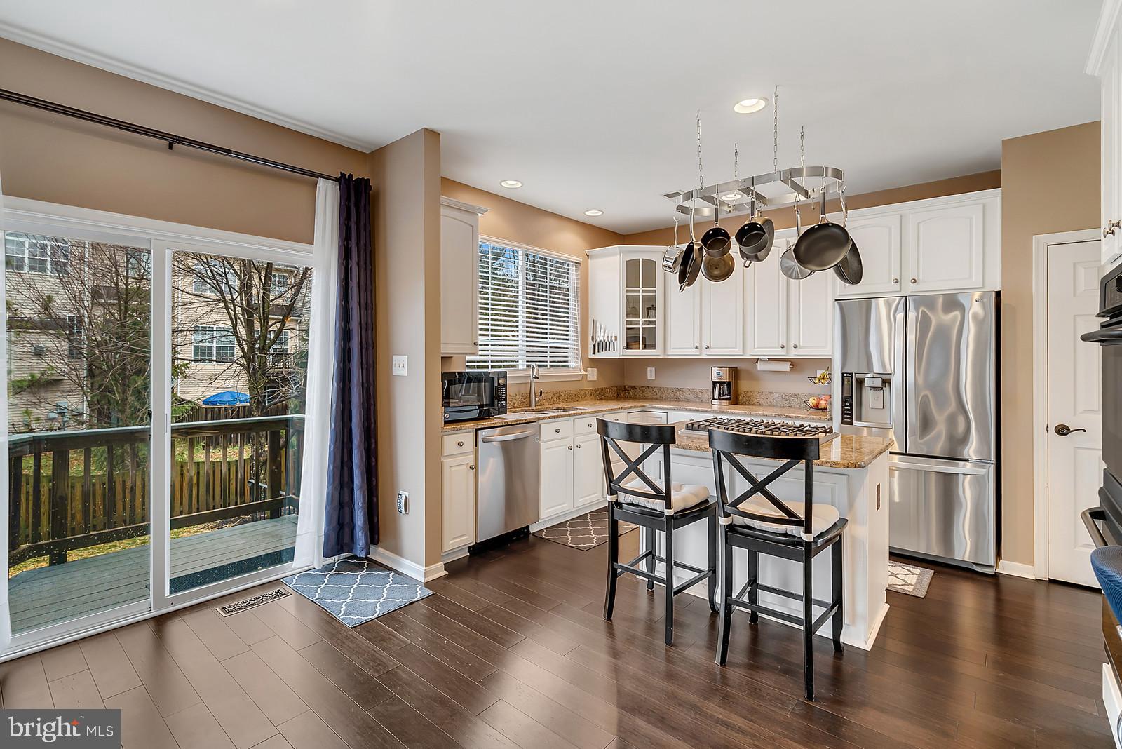 14320 Fallsmere Circle Gainesville, VA 20155 - Photo 6 of 50 Bright kitchen opens to trex deck and then patio