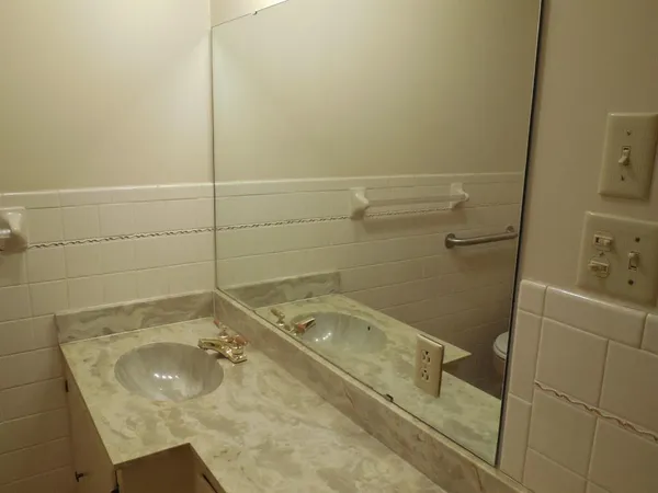 a bathroom with a sink and shower