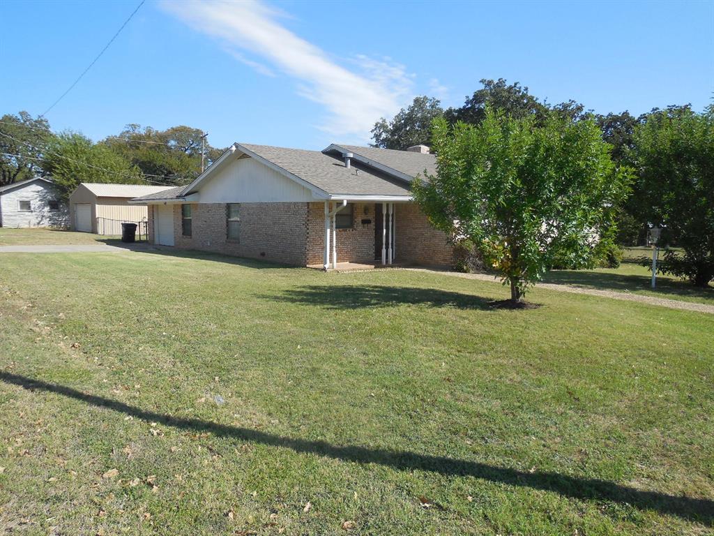 820 Walnut Street Ranger, TX 76470 - Photo 2 of 21 a house with huge green field in front of it