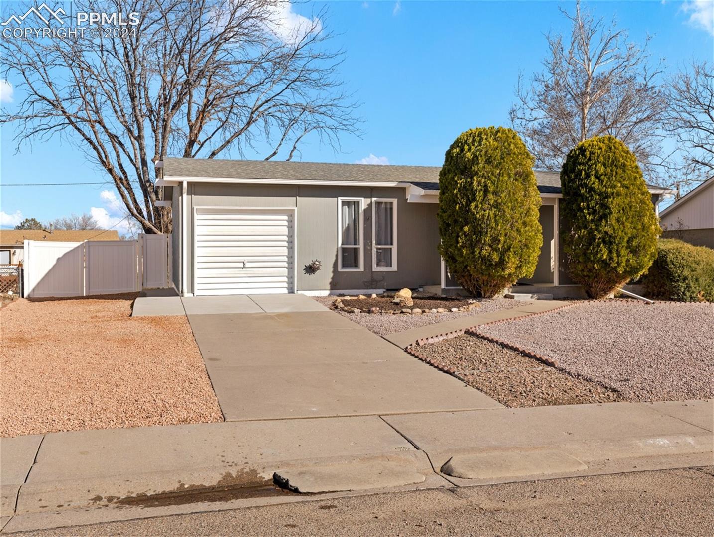 142 Mac Neil Road Pueblo, CO 81001 - Photo 1 of 24 Ranch-style home with a garage