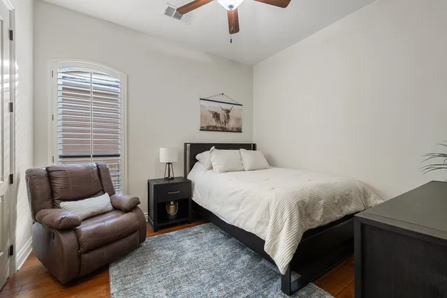 a bedroom with a bed and a couch