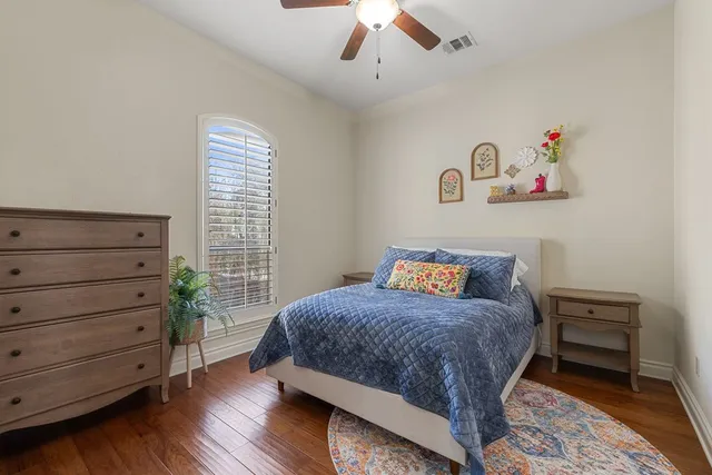 a bedroom with a bed and a bookshelf