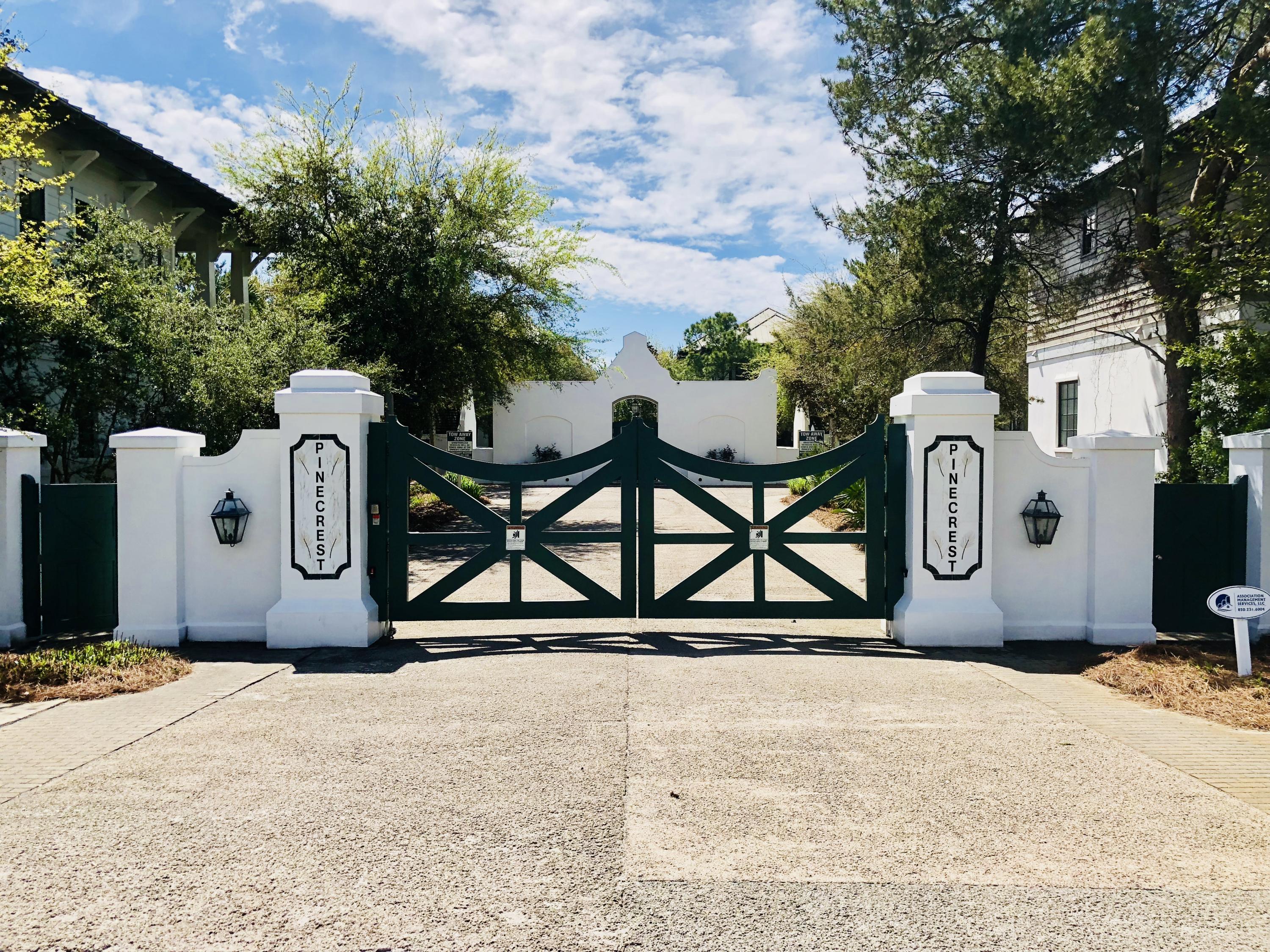 94 Pine Crest Circle Rosemary Beach, FL 32461 - Photo 6 of 24 a sign board with a bench under an umbrella