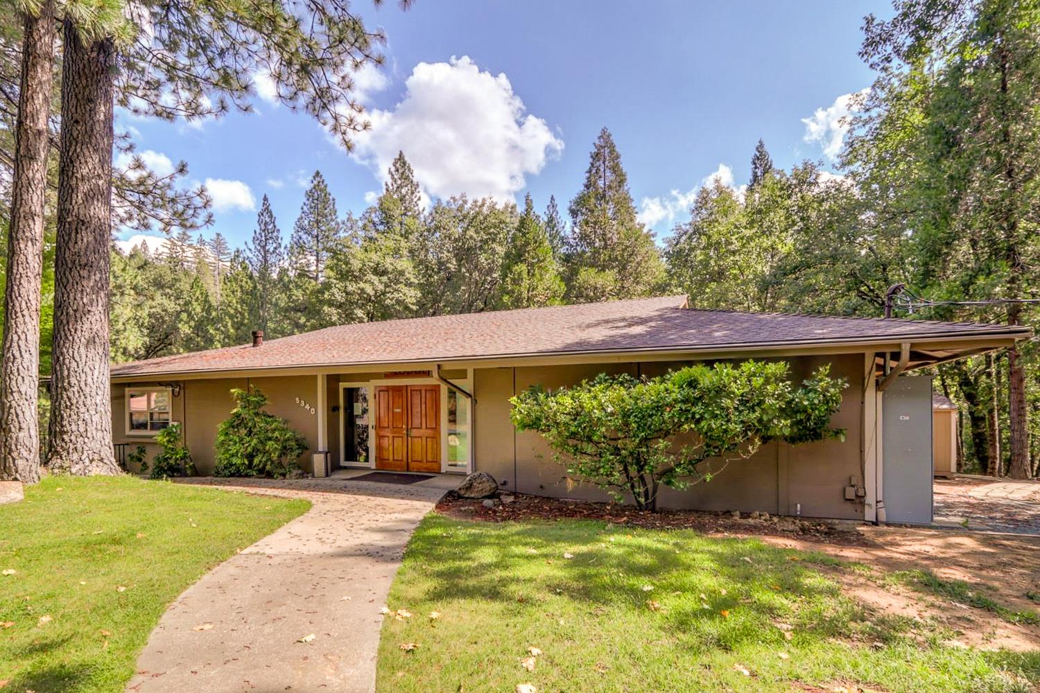 5015 Shooting Star Road Pollock Pines, CA 95726 - Photo 37 of 44 a view of a house with backyard and sitting area