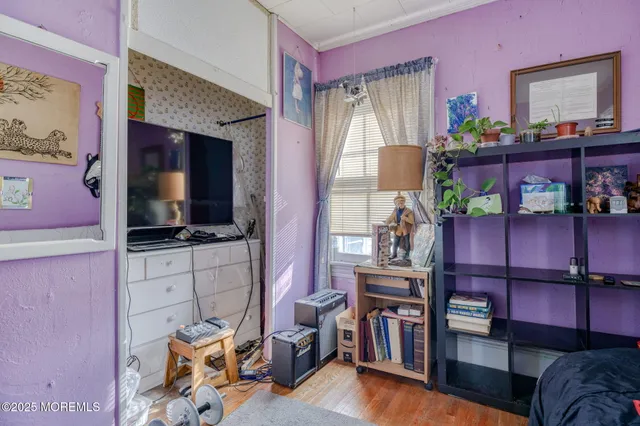a bedroom with bed and furniture
