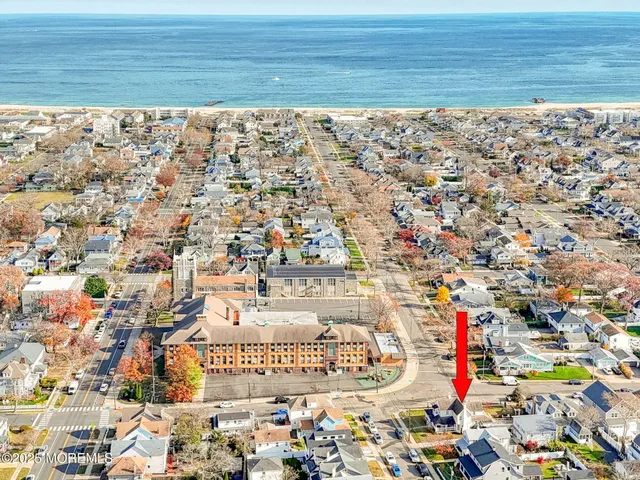 a front view of a house with a ocean view