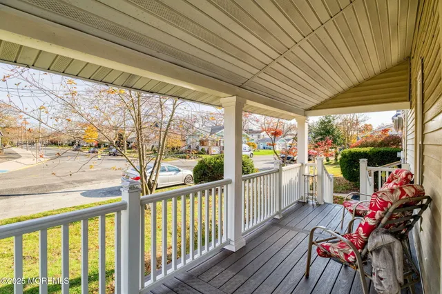 a view of deck with table and chairs and wooden floor