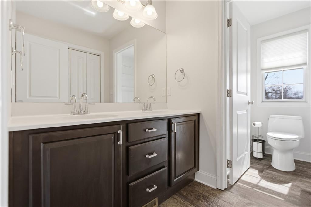 2094 Laurel Ridge Drive Clairton, PA 15025 - Photo 23 of 27 a bathroom with a granite countertop sink a toilet and a mirror