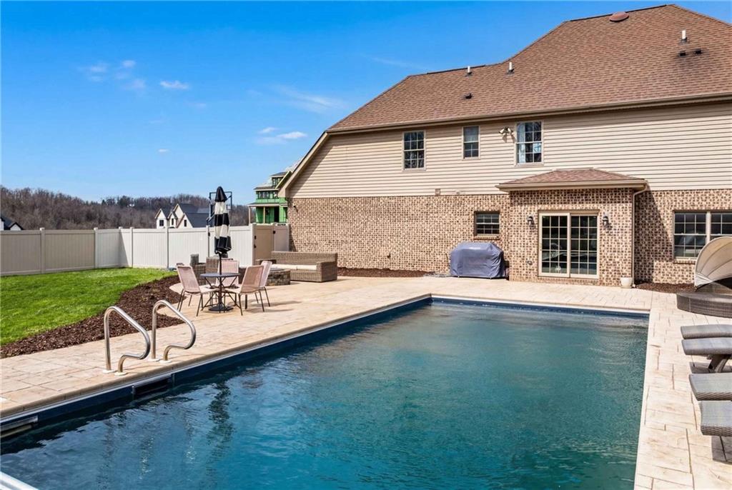 2094 Laurel Ridge Drive Clairton, PA 15025 - Photo 26 of 27 a view of a house with swimming pool and a yard