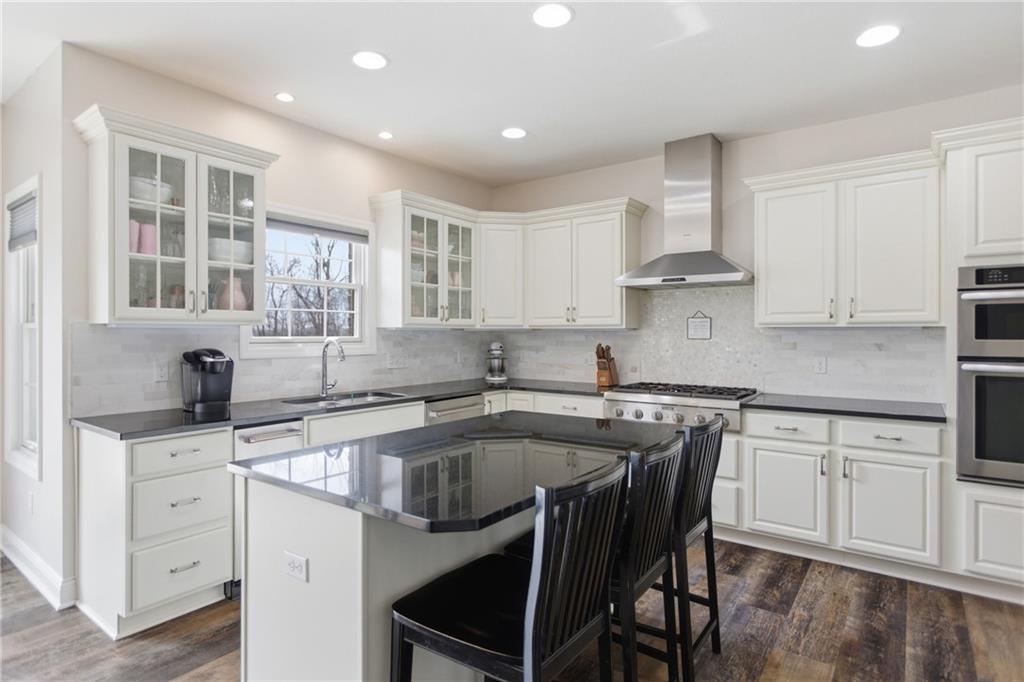 2094 Laurel Ridge Drive Clairton, PA 15025 - Photo 6 of 27 a kitchen with stainless steel appliances granite countertop a sink stove and cabinets