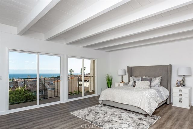 a bedroom with a large bed and a large window