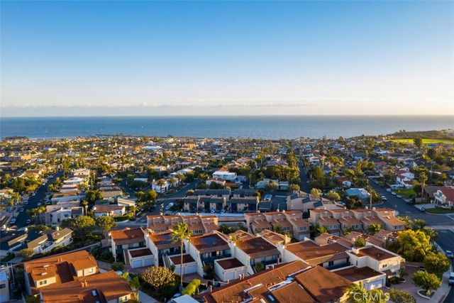 an aerial view of a city with parking space