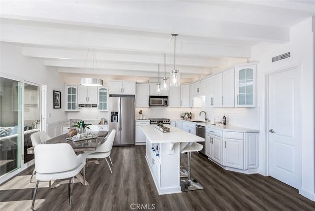 a view of a kitchen and dining room