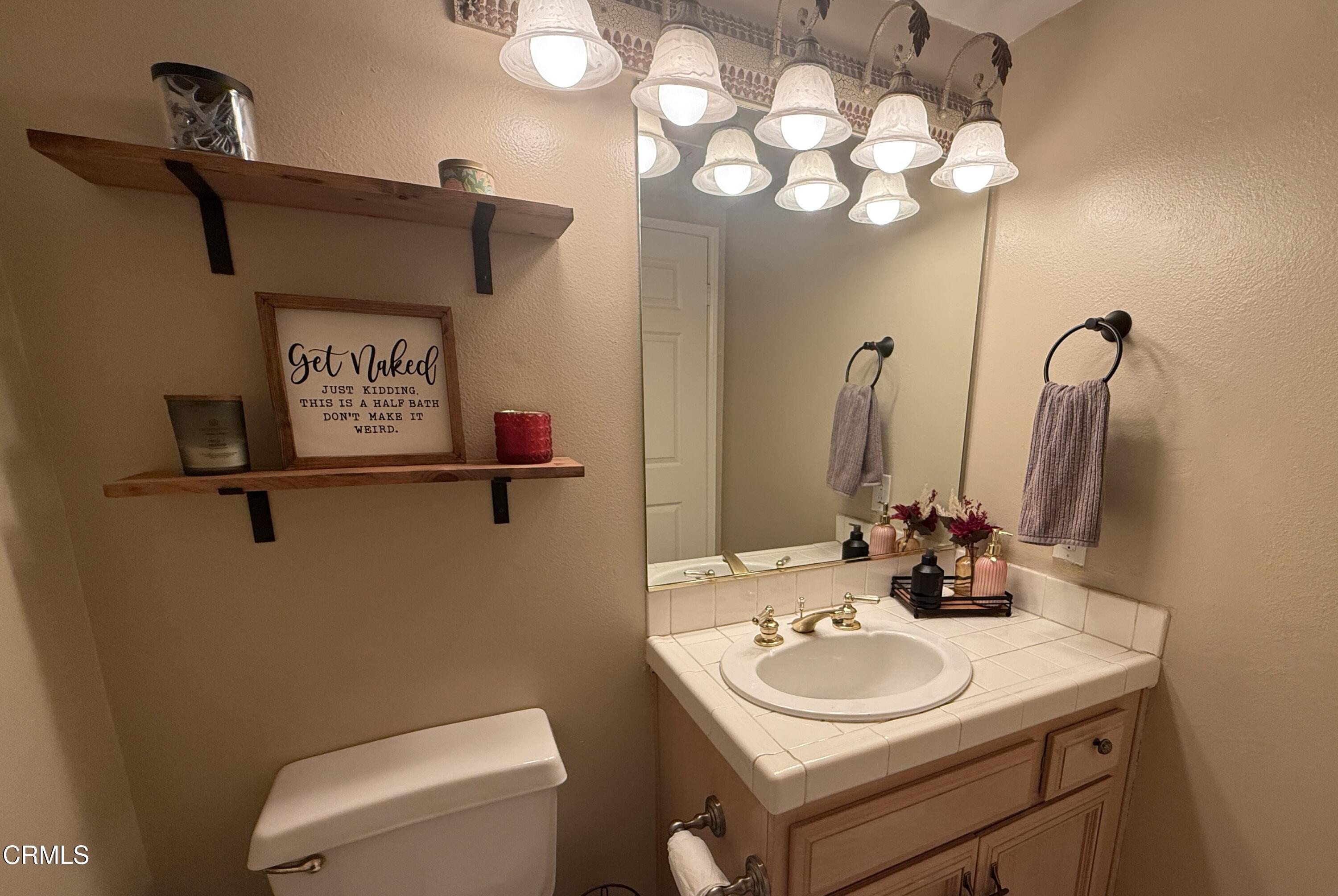 4259 Fulton Avenue, Unit 307 Sherman Oaks, CA 91423 - Photo 13 of 17 a bathroom with a sink and a mirror