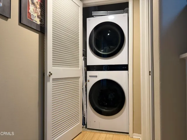 a view of a hallway with washer and dryer