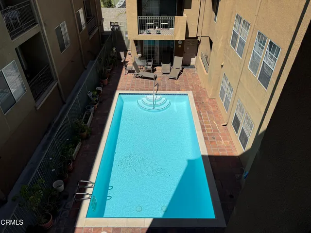 swimming pool view with a outdoor seating space
