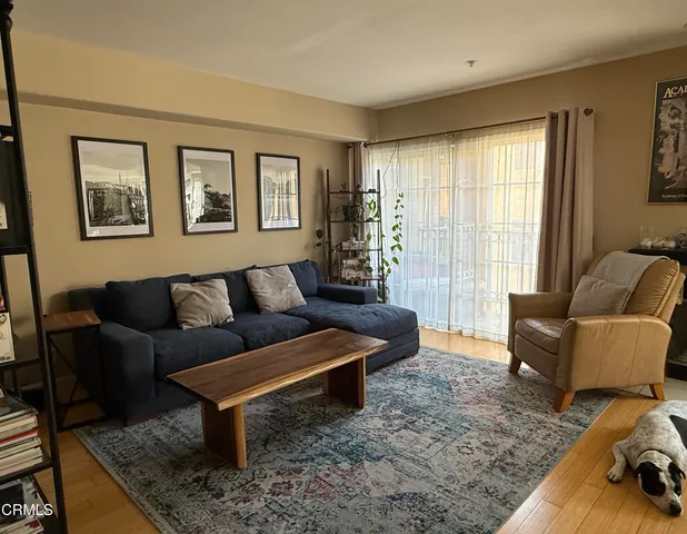 a living room with furniture and a rug