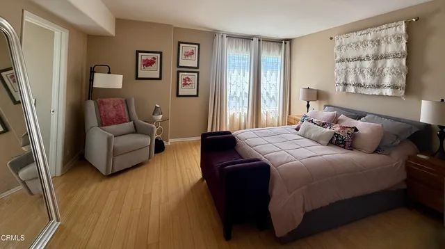 a bedroom with a bed and a couch