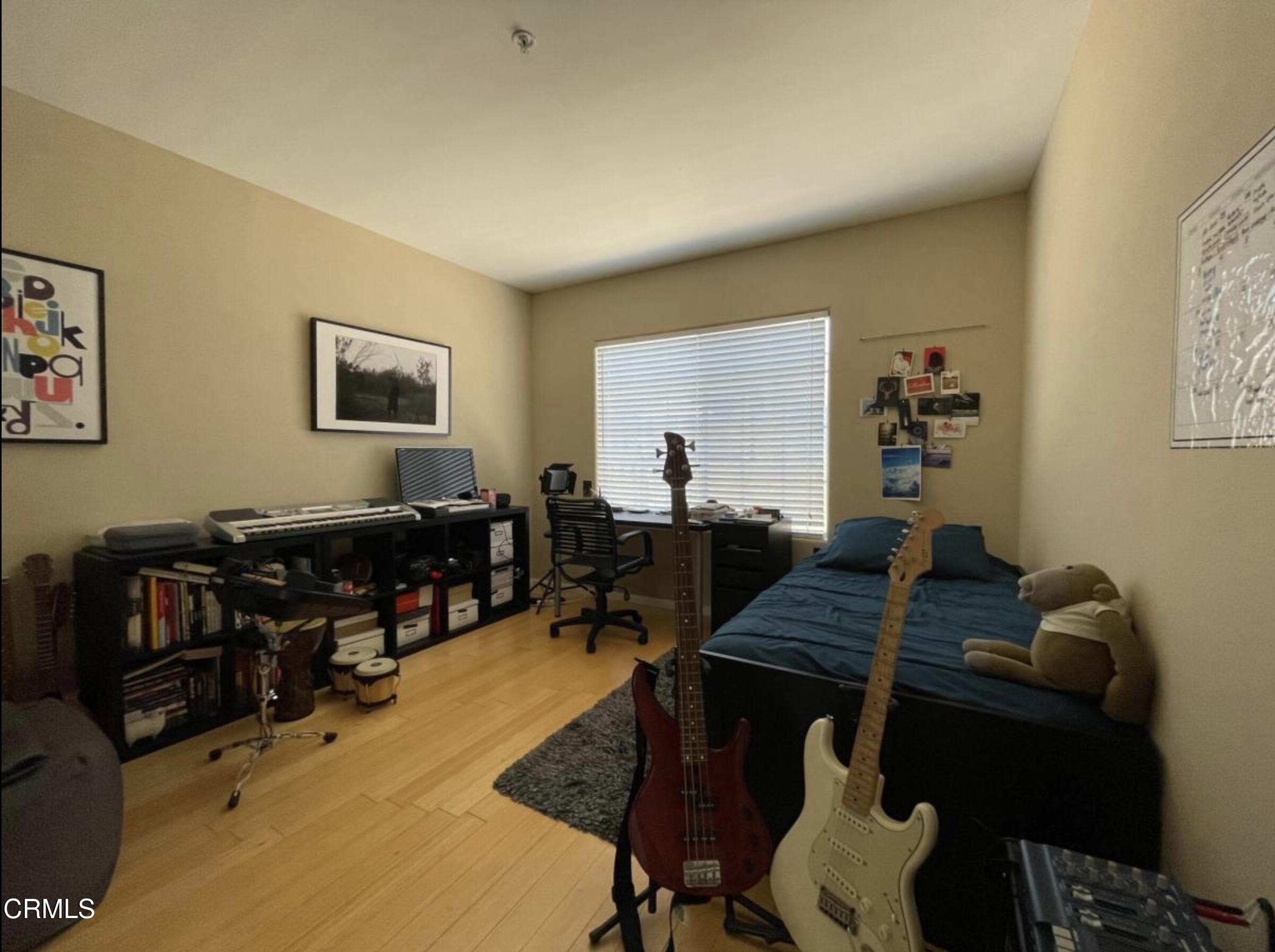 4259 Fulton Avenue, Unit 307 Sherman Oaks, CA 91423 - Photo 10 of 17 a living room with furniture and wooden floor