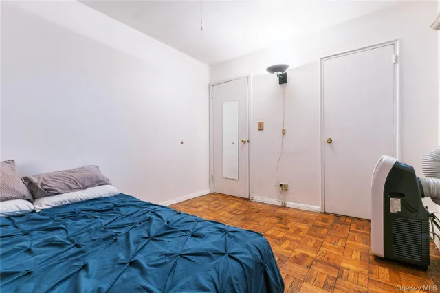 a bedroom with a bed and dresser