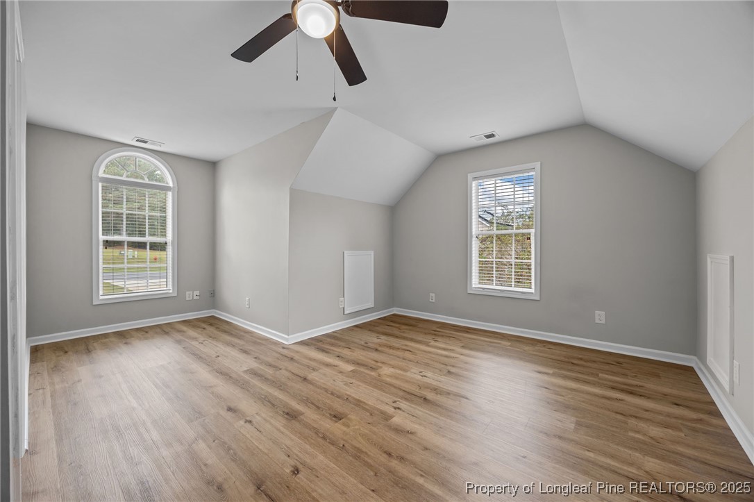 216 Cobblestone Drive Spring Lake, NC 28390 - Photo 17 of 38 wooden floor in an empty room with a window