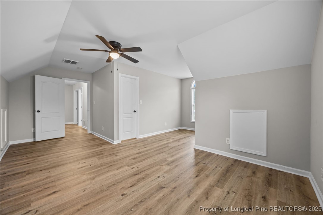 216 Cobblestone Drive Spring Lake, NC 28390 - Photo 18 of 38 wooden floor in an empty room with a window