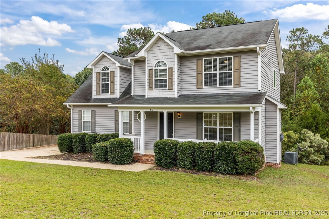 216 Cobblestone Drive Spring Lake, NC 28390 - Photo 2 of 38 a view of a house with a swimming pool