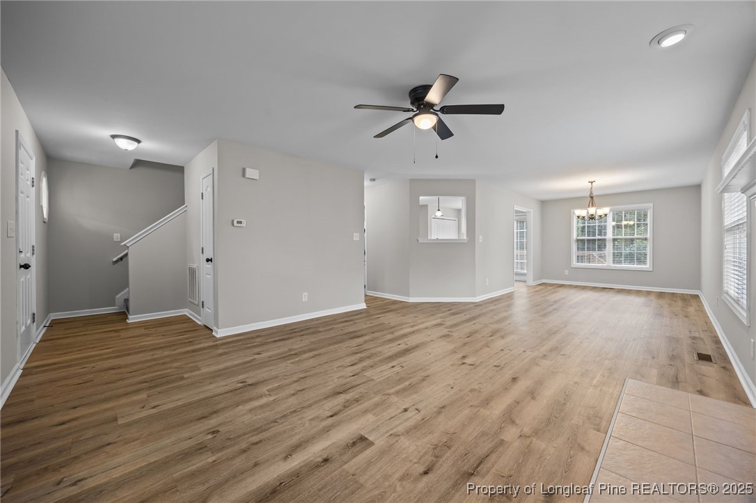 216 Cobblestone Drive Spring Lake, NC 28390 - Photo 21 of 38 a view of empty room with wooden floor and window