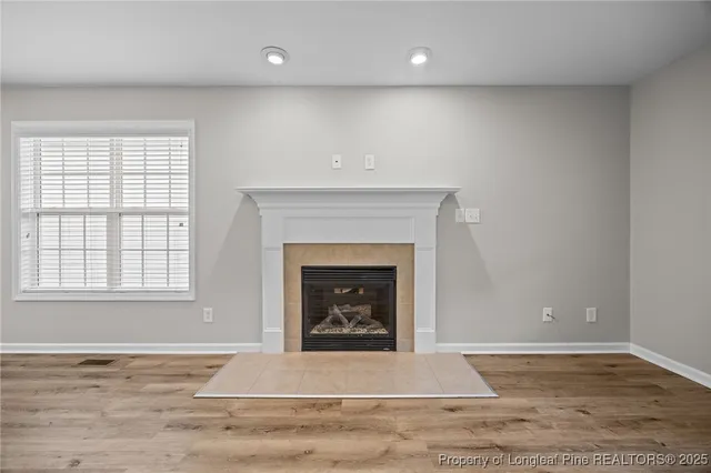 a living room with a fireplace and a fireplace