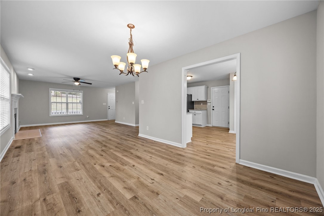 216 Cobblestone Drive Spring Lake, NC 28390 - Photo 26 of 38 wooden floor in an empty room with a window