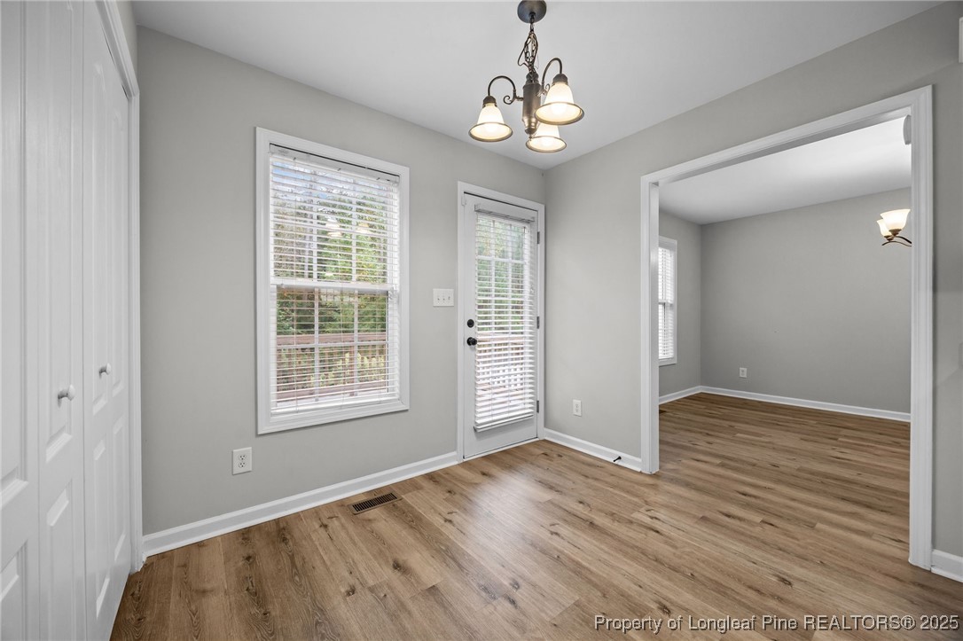 216 Cobblestone Drive Spring Lake, NC 28390 - Photo 27 of 38 a view of an empty room with wooden floor and a window