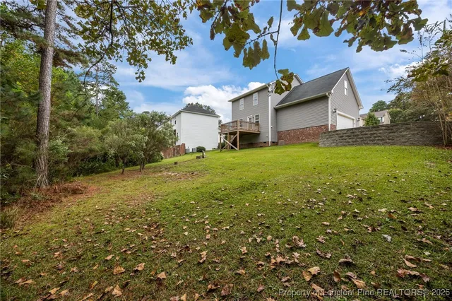 a view of a backyard with large trees
