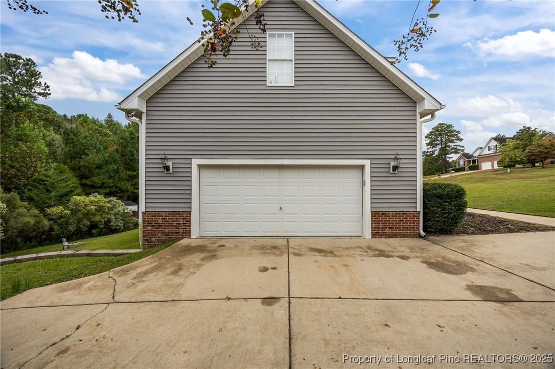 216 Cobblestone Drive Spring Lake, NC 28390 - Photo 37 of 38 a view of a house with a garage