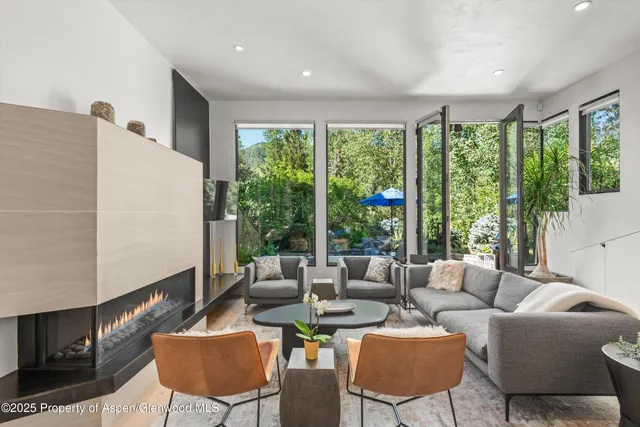 a living room with furniture and a large window