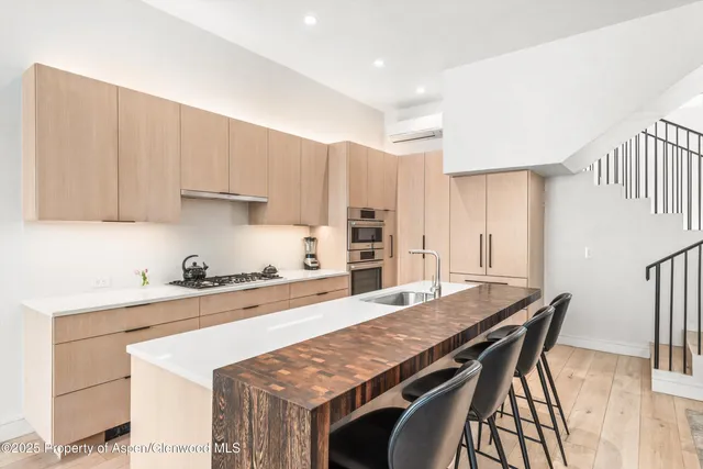 a kitchen with a table and chairs in it