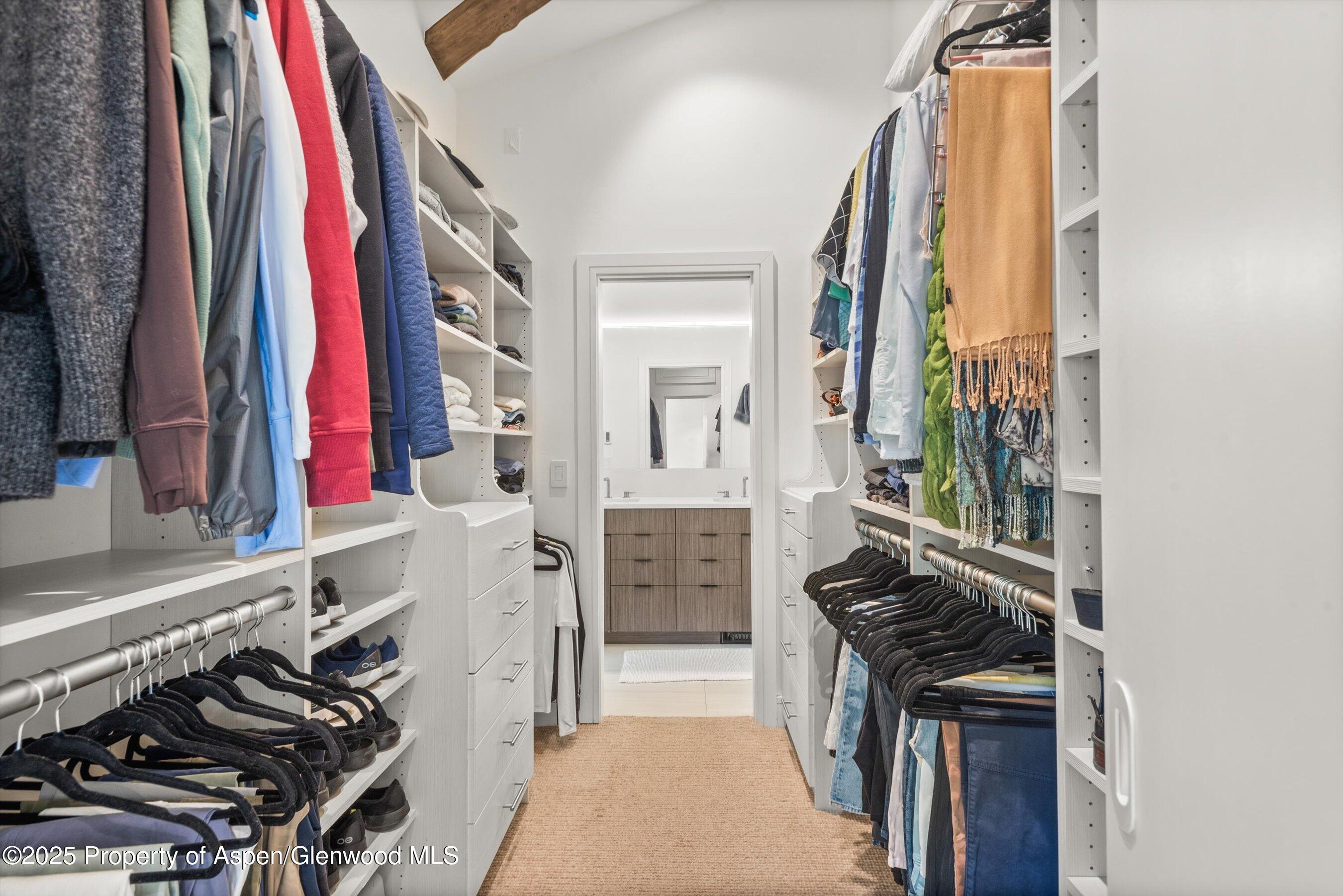 155 Lone Pine Road, Unit RIVER BLUFF #2 Aspen, CO 81611 - Photo 27 of 42 a view of walk in closet with clothes and shoes