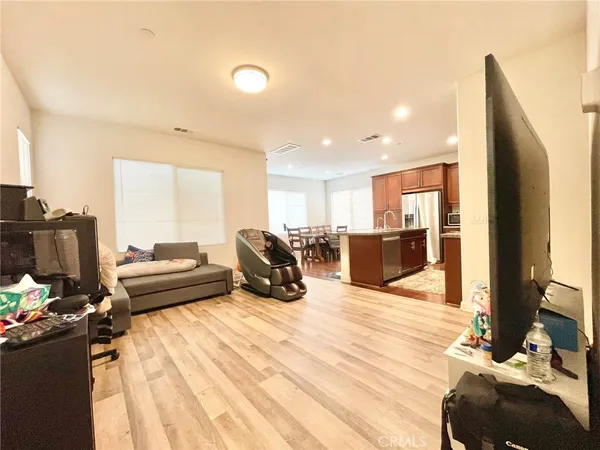 a bed room with a bed furniture and a flat screen tv