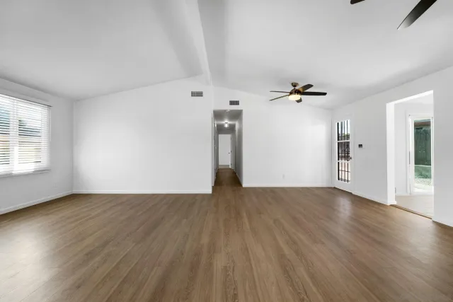 a view of a big room with chandelier fan and closet in a room