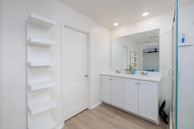a view of cabinets with wooden floor and window