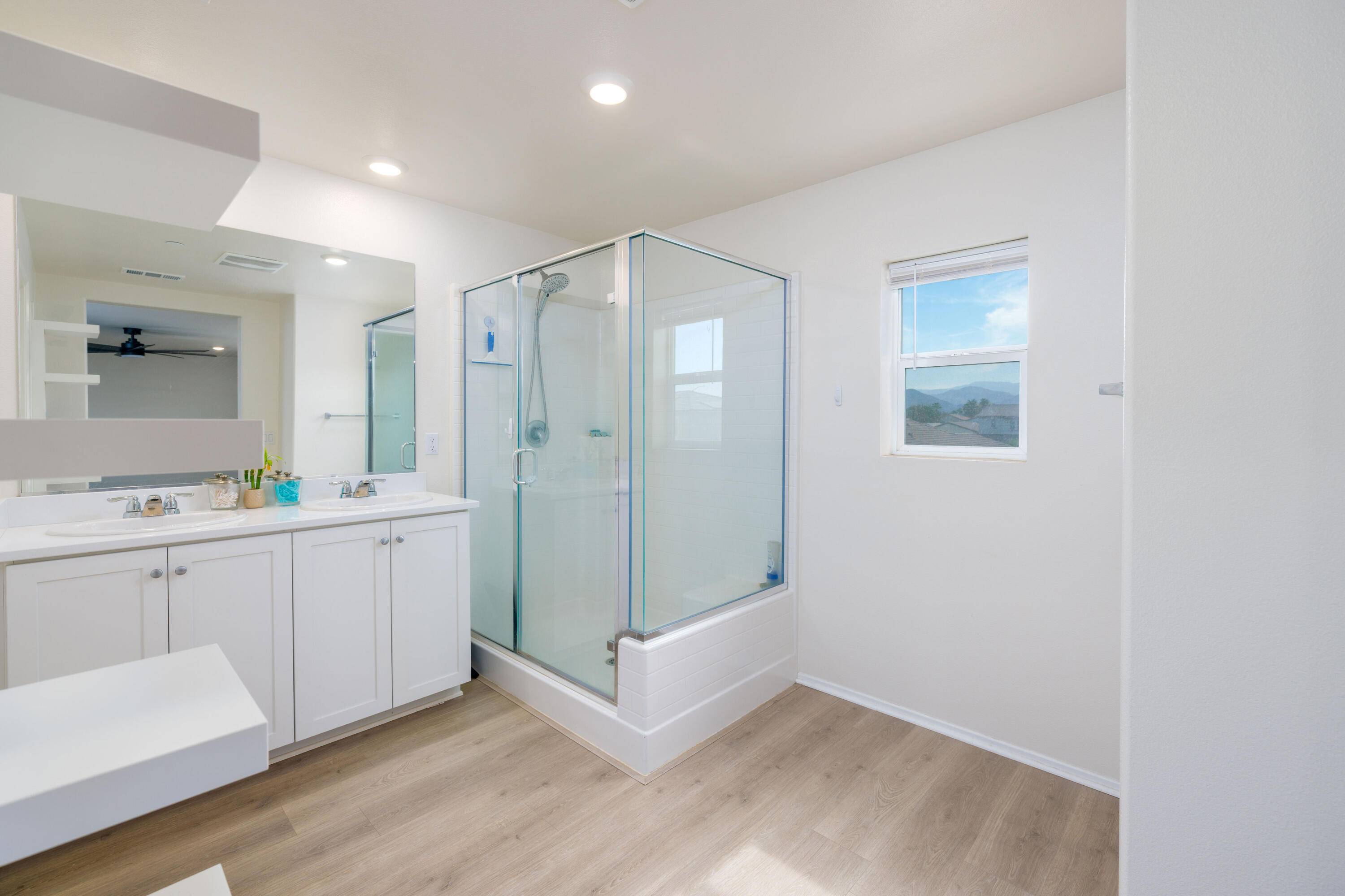 50187 Camino Rosario Coachella, CA 92236 - Photo 13 of 25 a view of cabinets with wooden floor and window