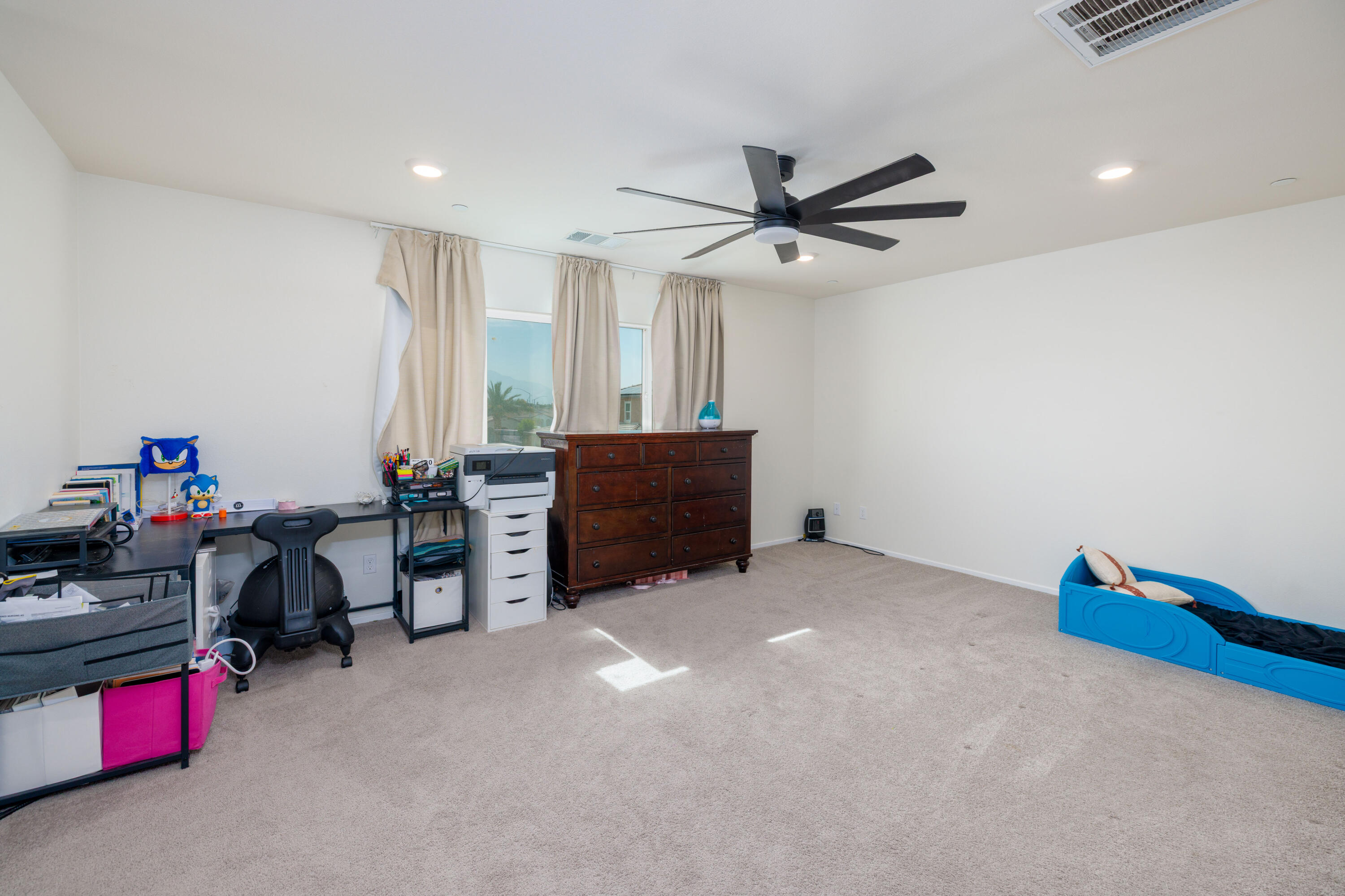 50187 Camino Rosario Coachella, CA 92236 - Photo 15 of 25 a living room with furniture and a air conditioner vent